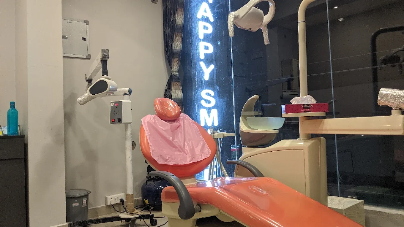 Dental chair with clinic name shown in background